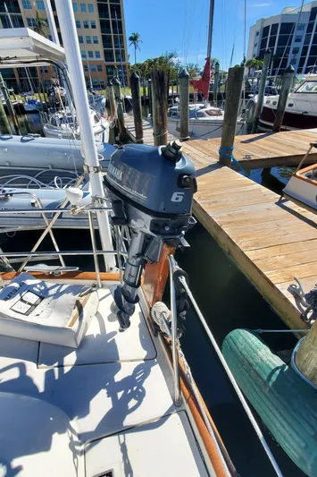  Yacht Photos Pics Outboard motor on 1999 Beneteau Oceanis 44 CC sailboat docked at marina.