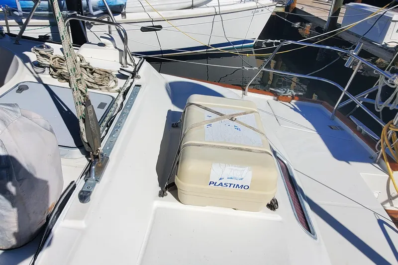  Yacht Photos Pics 1999 Beneteau Oceanis 44 CC deck with Plastimo equipment, docked at marina.