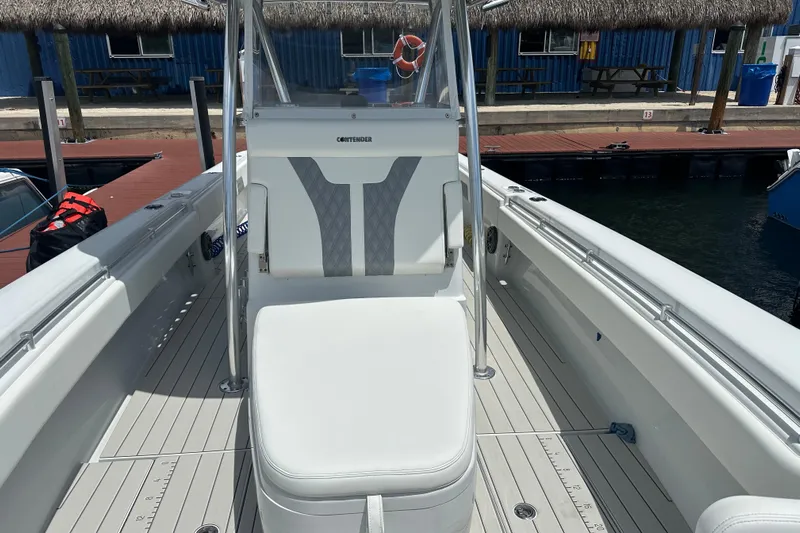  Yacht Photos Pics 2019 Contender 35 ST boat interior with white seating and sleek design at dock.