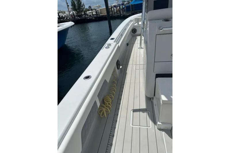  Yacht Photos Pics 2019 Contender 35 ST boat deck with clean, sleek design and dockside view.