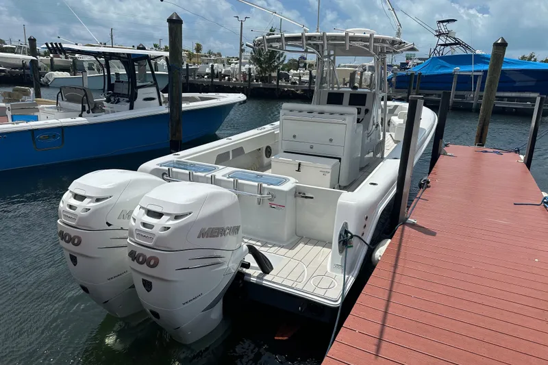  Yacht Photos Pics 2019 Contender 35 ST boat docked, featuring dual Mercury 400 engines.