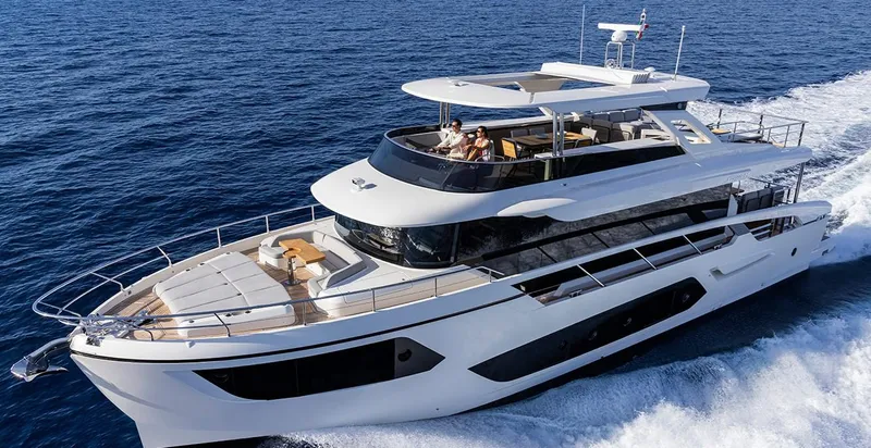 Absolute Navetta 75 Yacht Photos Pics Luxurious 2025 Absolute NAVETTA 75 yacht cruising on open sea, showcasing sleek design and elegance.