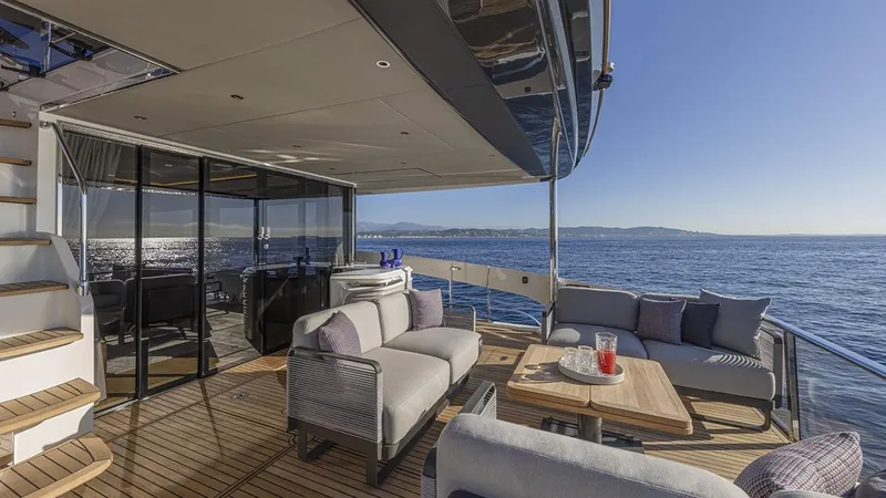 Absolute Navetta 75 Yacht Photos Pics Luxurious 2025 Absolute NAVETTA 75 yacht deck with elegant seating and ocean view.