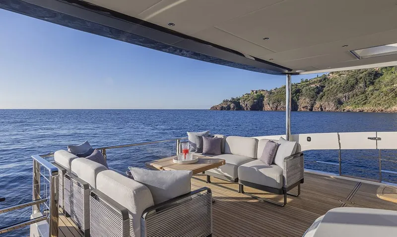 Absolute Navetta 75 Yacht Photos Pics Luxurious deck of 2025 Absolute NAVETTA 75 yacht with ocean view and comfortable seating.