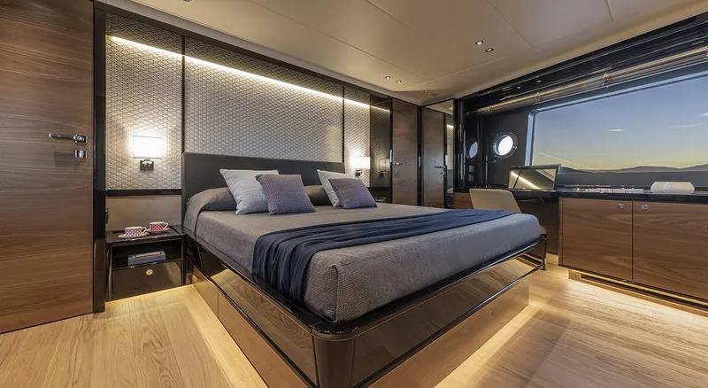 Absolute Navetta 75 Yacht Photos Pics Luxurious bedroom interior of 2025 Absolute NAVETTA 75 yacht with modern design and ocean view.