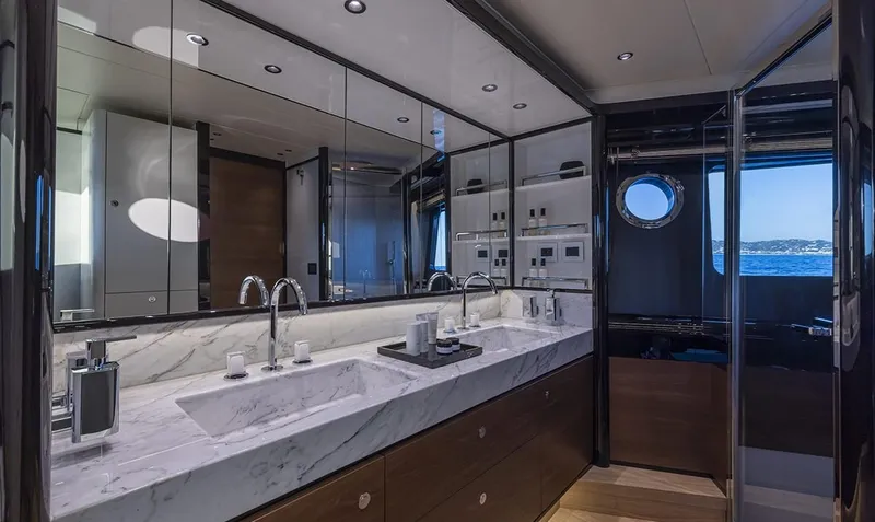Absolute Navetta 75 Yacht Photos Pics Luxurious bathroom interior on Absolute NAVETTA 75 yacht, featuring dual sinks and elegant design, 2025 model.