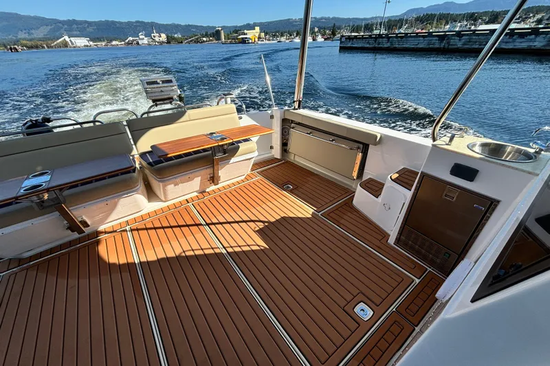  Yacht Photos Pics 2022 Ranger Tugs R-43 CB boat deck with seating and scenic water view.