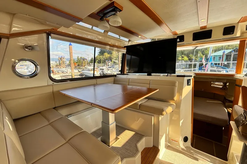  Yacht Photos Pics Interior of 2022 Ranger Tugs R-43 CB with dining area and large windows.
