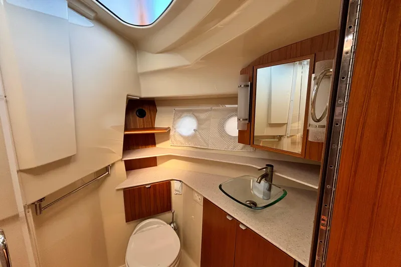  Yacht Photos Pics Luxurious 2022 Ranger Tugs R-43 CB bathroom with modern fixtures and wood accents.