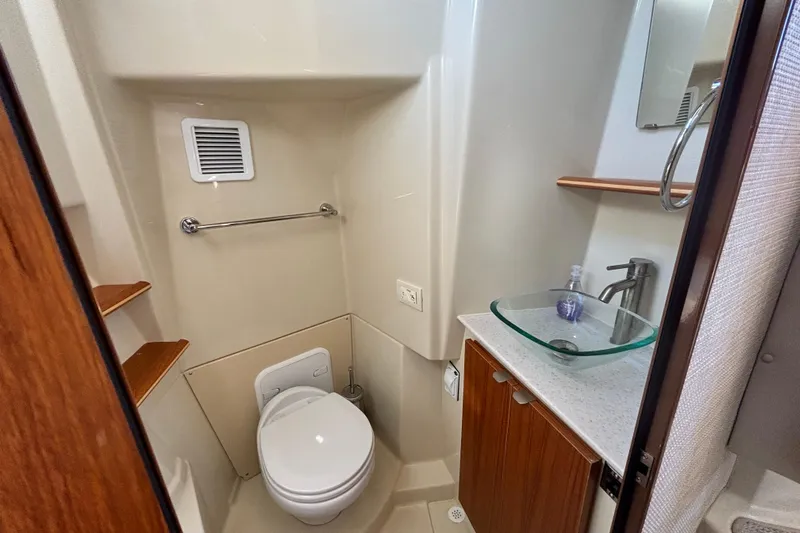  Yacht Photos Pics 2022 Ranger Tugs R-43 CB bathroom with modern fixtures and glass sink.