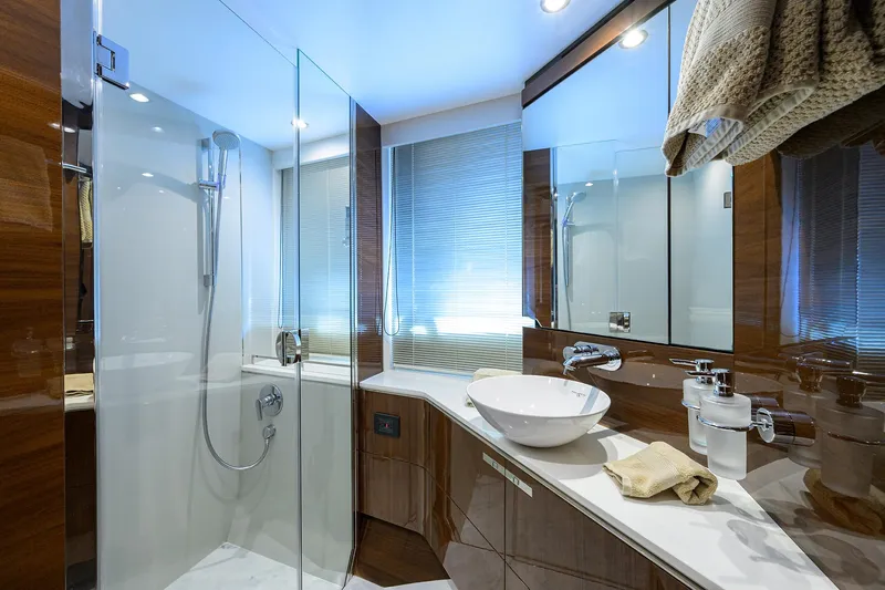 Gallant Lady Yacht Photos Pics Luxurious bathroom in 2018 Princess 65S yacht with modern fixtures and glass shower.