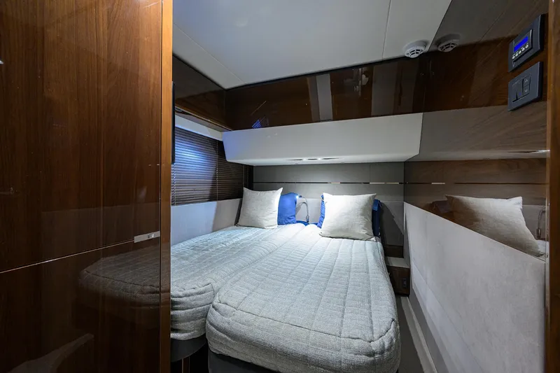 Gallant Lady Yacht Photos Pics Luxurious cabin interior of 2018 Princess 65S yacht with twin beds and modern decor.