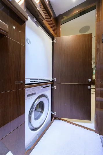 Gallant Lady Yacht Photos Pics Laundry area with a washing machine in a 2018 Princess 65S yacht.