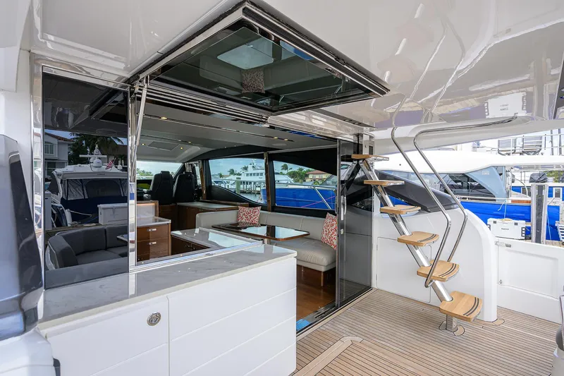 Gallant Lady Yacht Photos Pics Luxurious 2018 Princess 65S yacht interior with modern seating and elegant staircase.