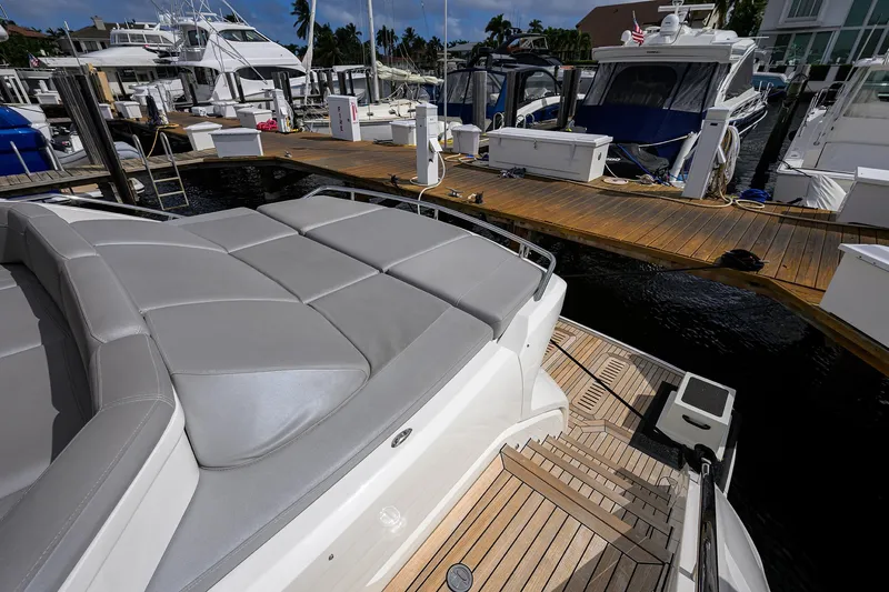 Gallant Lady Yacht Photos Pics Luxury Princess 65S yacht docked at marina, showcasing sleek design and spacious deck.