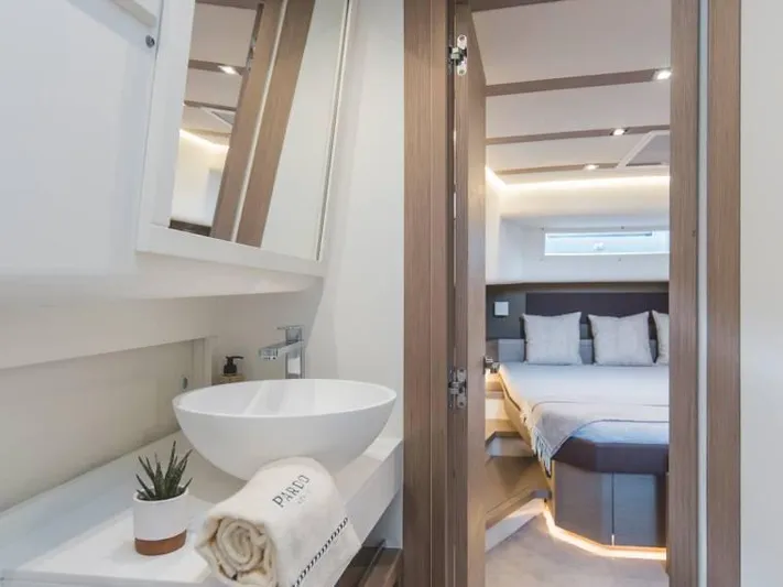 Ban Ban Yacht Photos Pics Luxurious interior of 2023 Pardo Yachts 50, featuring modern bathroom and cozy bedroom.