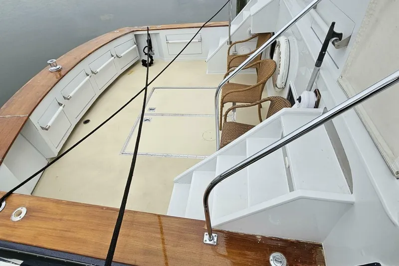 Summer Song Yacht Photos Pics 1969 Derecktor 68 Hunt Motor Yacht deck with seating and wooden accents.