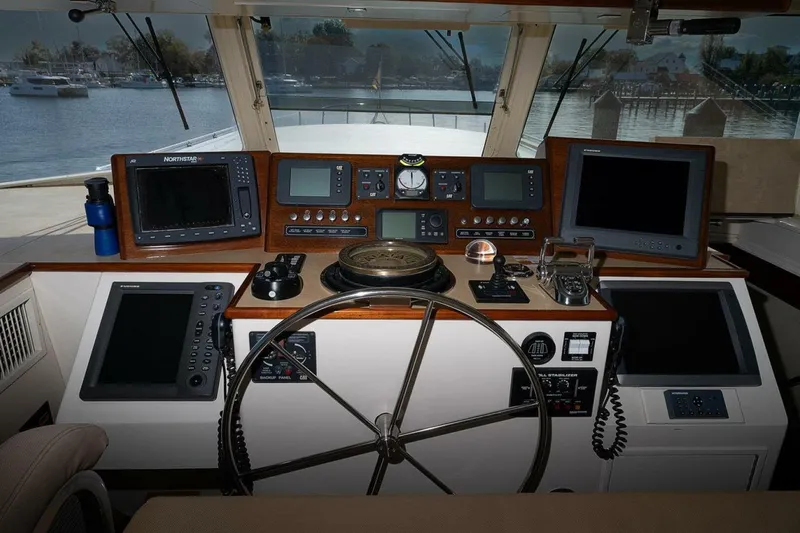 Summer Song Yacht Photos Pics Cockpit of 1969 Derecktor 68 Hunt Motor Yacht with navigation equipment and steering wheel.