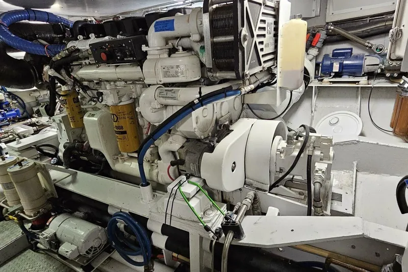 Summer Song Yacht Photos Pics Engine room of 1969 Derecktor 68 Hunt Motor Yacht, showcasing mechanical components.