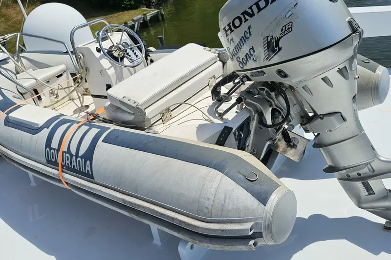 Summer Song Yacht Photos Pics 1969 Derecktor 68 Hunt Motor Yacht with Novurania inflatable boat and Honda outboard motor.