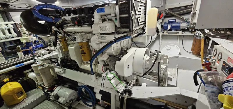 Summer Song Yacht Photos Pics Engine room of a 1969 Derecktor Hunt M.Y. yacht with visible machinery and equipment.