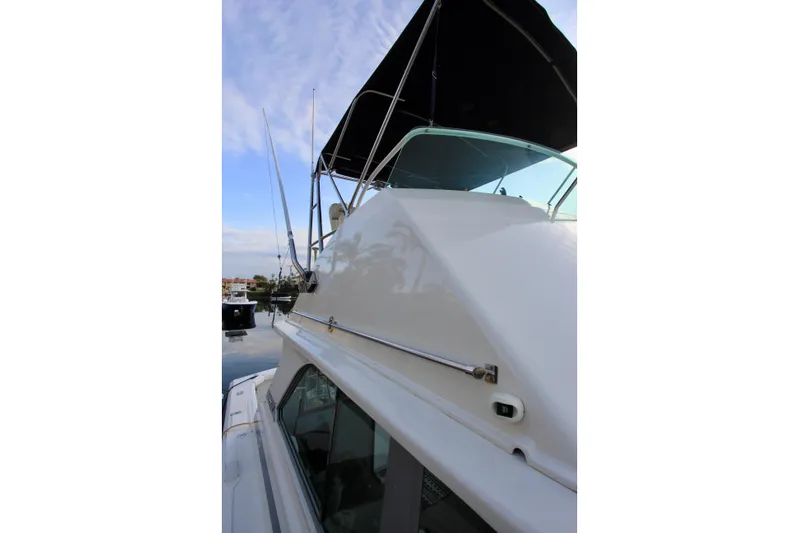 La Dorada Yacht Photos Pics 1980 Bertram 35 Flybridge boat with sleek design and flybridge canopy.