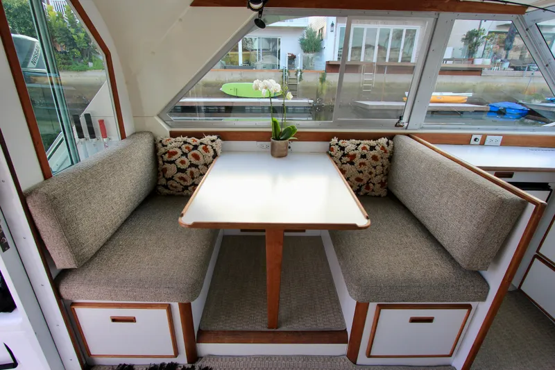 La Dorada Yacht Photos Pics port side dinette with storage under seats. Custom Interior by Crystaliner Corp.