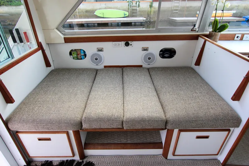 La Dorada Yacht Photos Pics port side dinette converts to 6'2" bunk. Custom Interior by Crystaliner Corp.