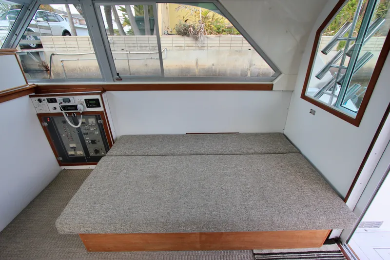 La Dorada Yacht Photos Pics Starboard side convertible sofa. 6' 6" Custom Interior by Crystaliner Corp.