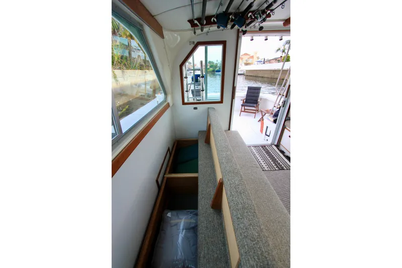 La Dorada Yacht Photos Pics Ample storage under convertible sofa. Starboard side convertible sofa. Custom Interior by Crystaliner Corp.