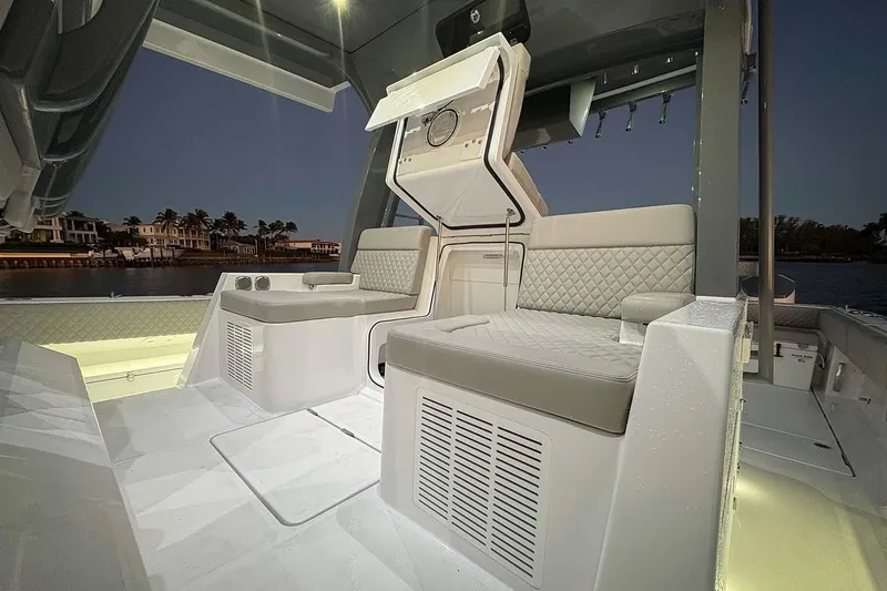  Yacht Photos Pics Manufacturer Provided Image: Luxurious interior of 2026 HCB 56 Suenos GIX boat at dusk, featuring elegant seating.