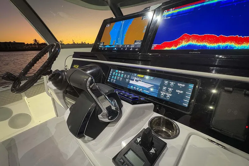  Yacht Photos Pics Manufacturer Provided Image: Helm of 2026 HCB 56 Suenos GIX with advanced navigation displays at sunset.