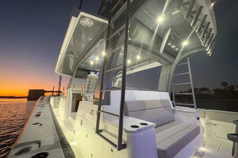  Yacht Photos Pics Manufacturer Provided Image: 2026 HCB 56 Suenos GIX luxury boat at sunset, featuring modern seating and lighting.