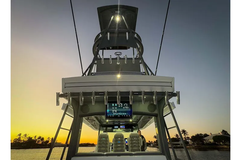  Yacht Photos Pics Manufacturer Provided Image: 2026 HCB 56 Suenos GIX boat at sunset, featuring advanced navigation systems and sleek design.