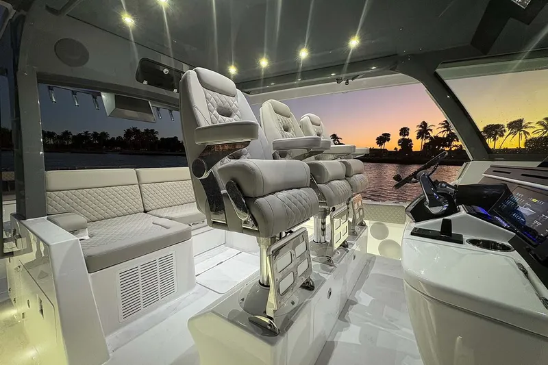  Yacht Photos Pics Manufacturer Provided Image: Luxurious interior of 2026 HCB 56 Suenos GIX yacht at sunset, featuring plush seating.