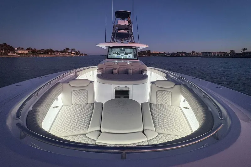  Yacht Photos Pics Manufacturer Provided Image: Luxurious 2026 HCB 56 Suenos GIX yacht with illuminated seating at dusk on the water.
