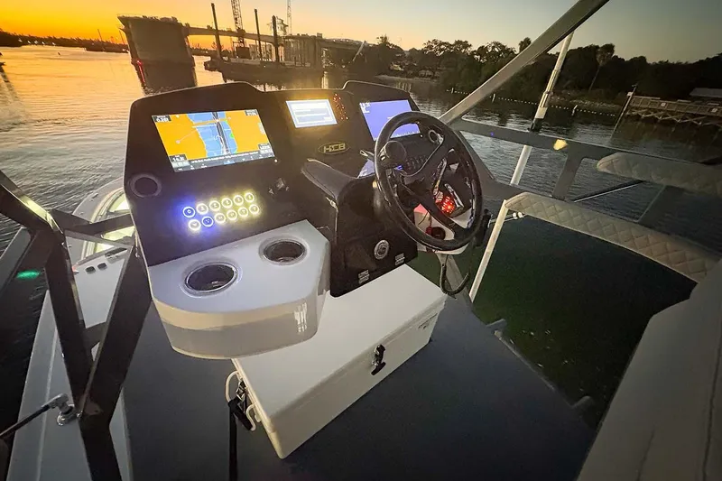  Yacht Photos Pics Manufacturer Provided Image: Helm of 2026 HCB 56 Suenos GIX yacht at sunset, featuring advanced navigation displays.