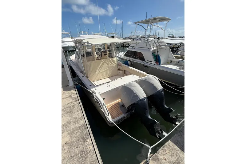  Yacht Photos Pics 2008 Grady-White Marlin 300 boat docked with twin outboard engines.