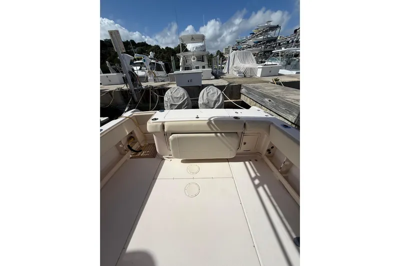  Yacht Photos Pics 2008 Grady-White Marlin 300 boat interior at marina, clear sky background.