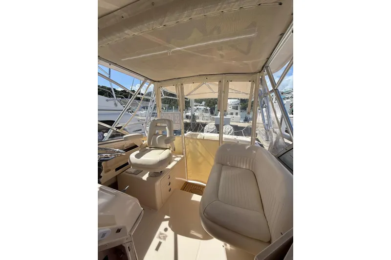  Yacht Photos Pics 2008 Grady-White Marlin 300 boat interior with helm and seating area.