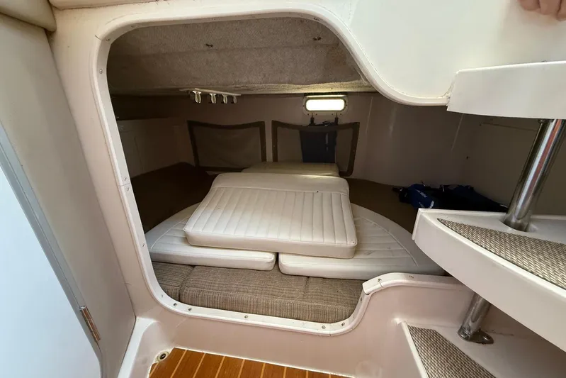  Yacht Photos Pics 2008 Grady-White Marlin 300 cabin interior with cushioned seating and compact design.