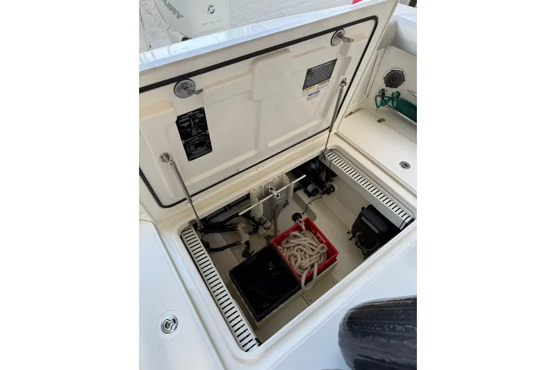  Yacht Photos Pics 2016 Boston Whaler 330 Outrage storage compartment with ropes and equipment.