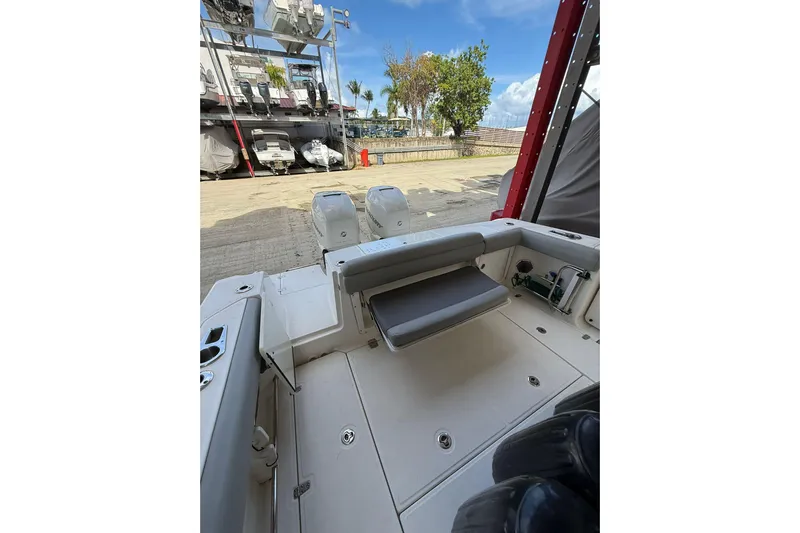  Yacht Photos Pics 2016 Boston Whaler 330 Outrage boat interior with seating and dual engines.