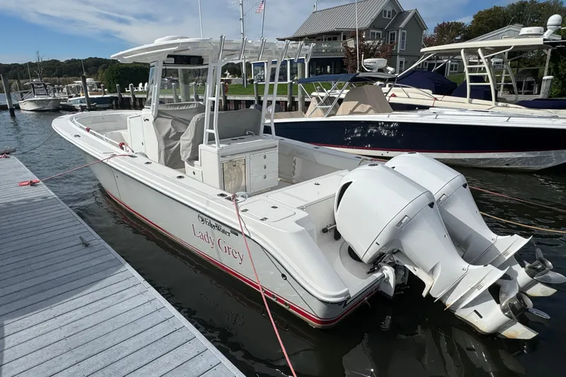 Lady Grey Yacht Photos Pics 2016 Edgewater 320CC boat named "Lady Grey" docked at a marina.