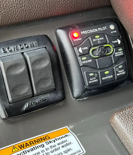  Yacht Photos Pics Control panel of a 2016 Sea Ray 350 SLX boat with warning label.