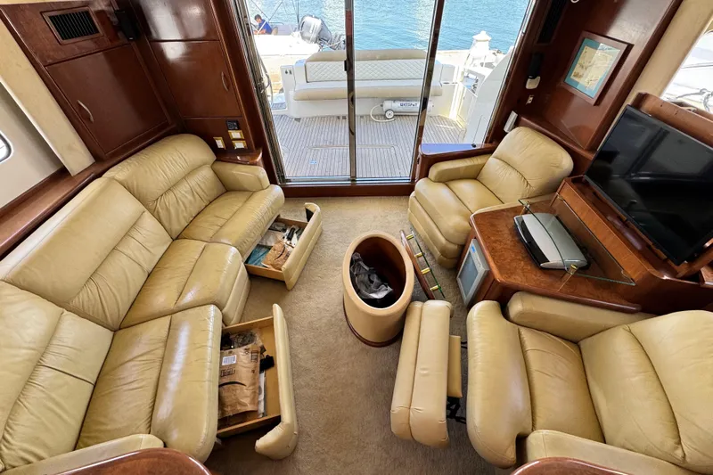  Yacht Photos Pics Luxurious interior of 2009 Ovation 52 yacht with leather seating and entertainment system.