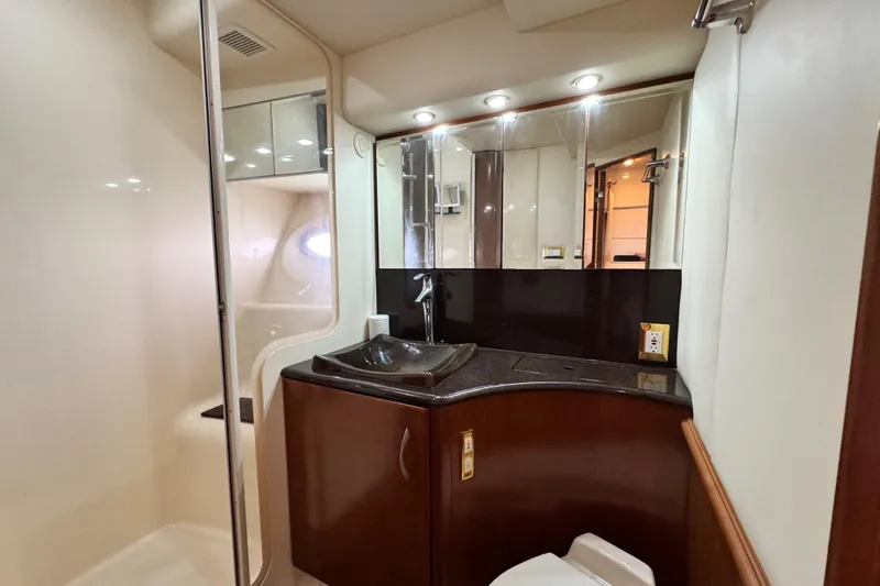  Yacht Photos Pics Luxurious bathroom in 2009 Ovation 52 yacht with modern fixtures and elegant design.