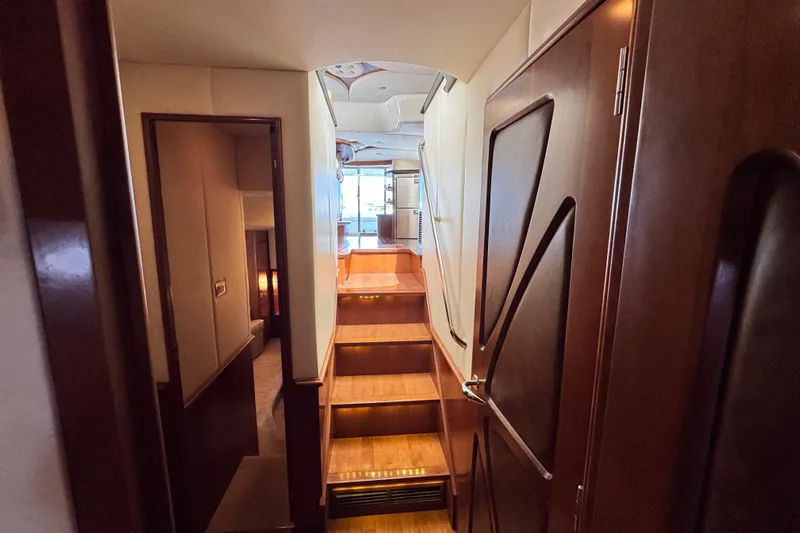  Yacht Photos Pics Interior of a 2009 Ovation 52 yacht with wooden staircase.