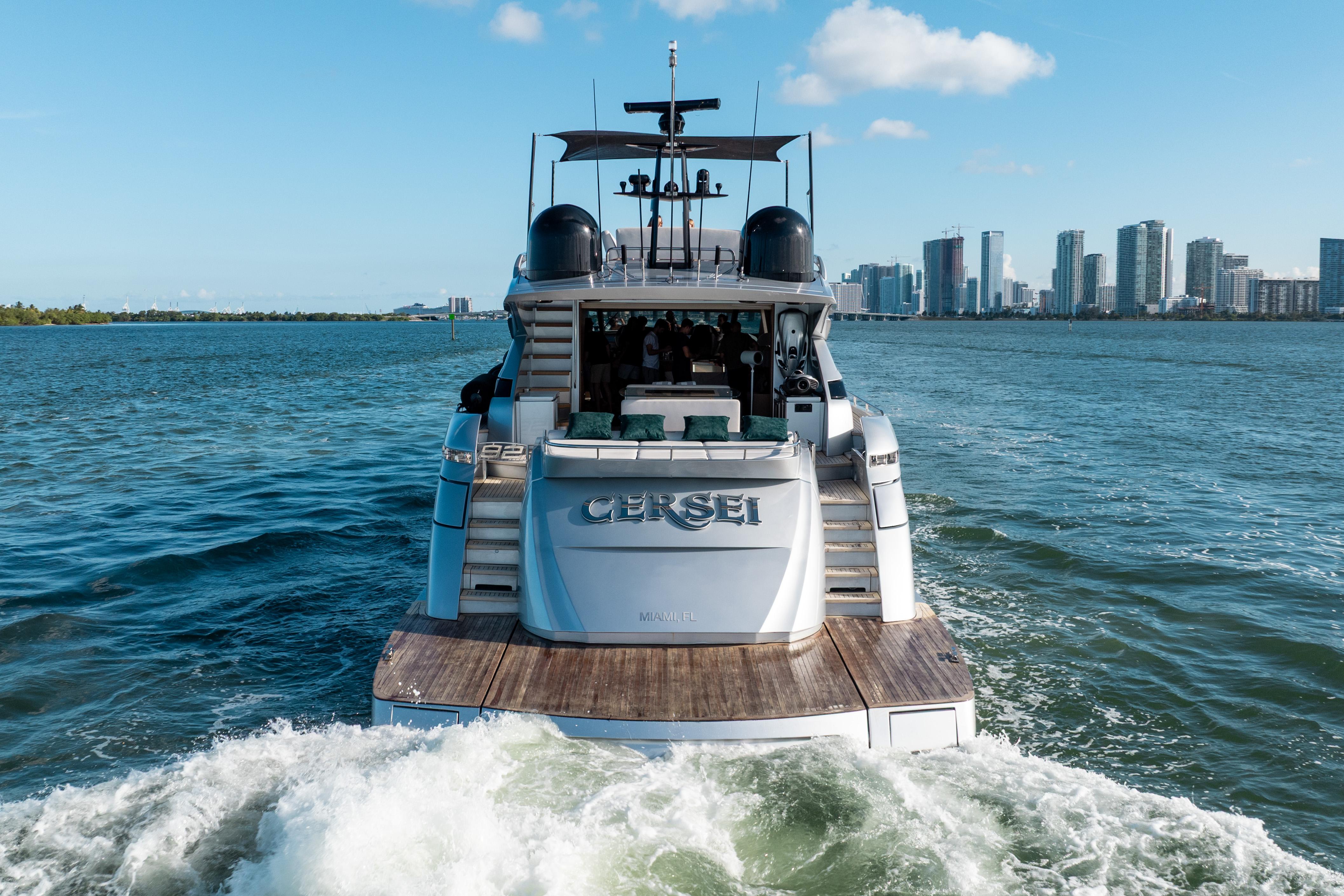 Luxury Pershing 92 yacht cruising near city skyline, 2012 model.