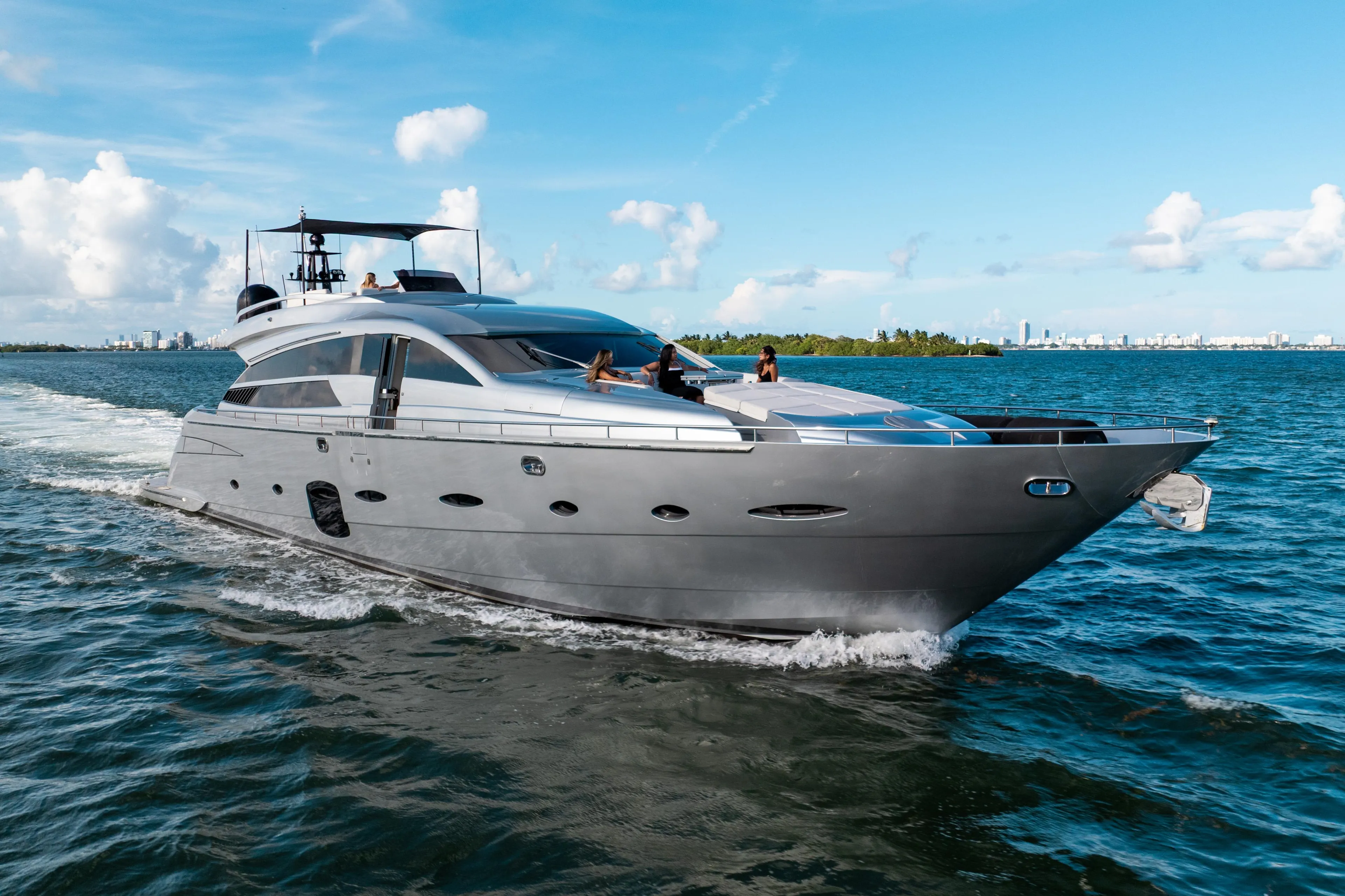 Luxury 2012 Pershing 92 yacht cruising on open water under a clear blue sky.